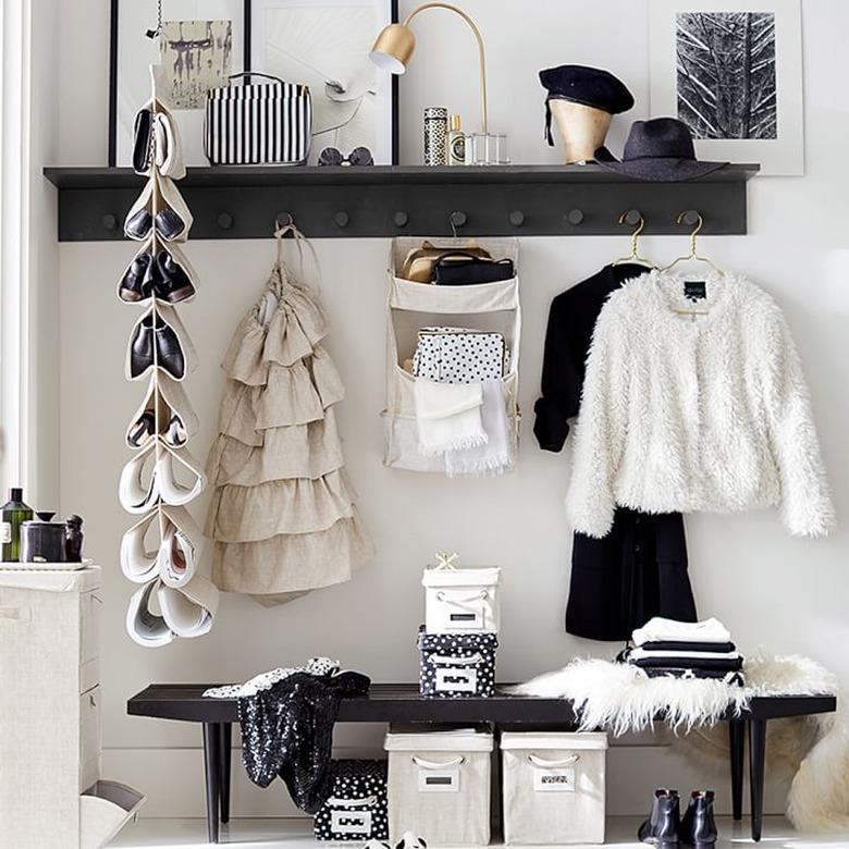 Purses peeking from a hanging organizer