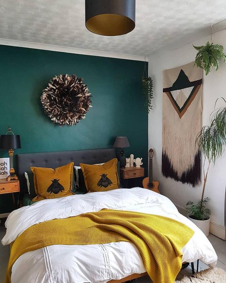 bedroom with green accent wall