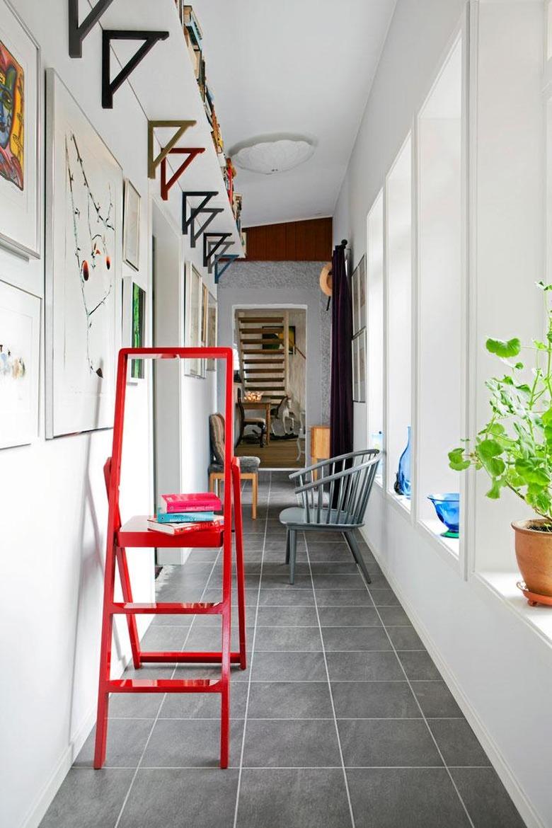 shelving in small hallway with red step ladder