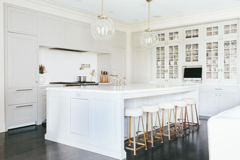 all-white L-shaped kitchen