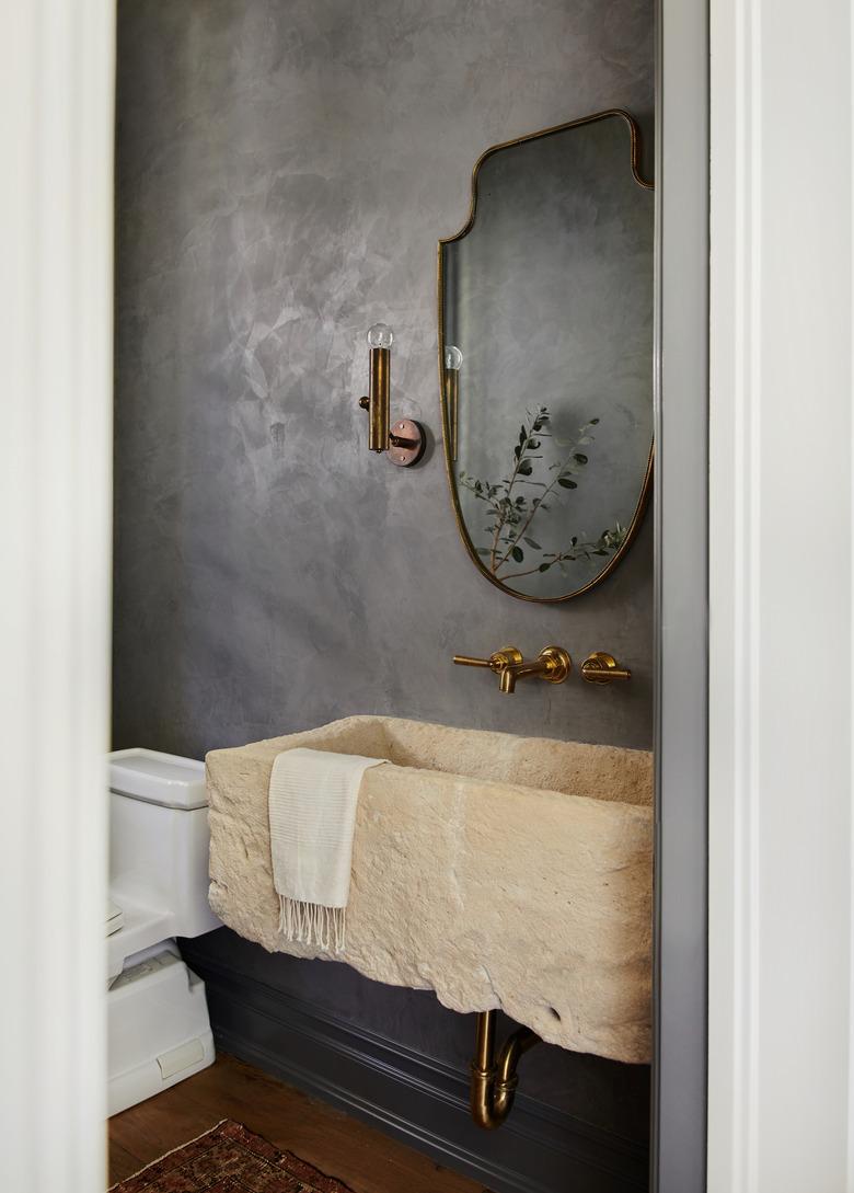 textured gray wall in small bathroom