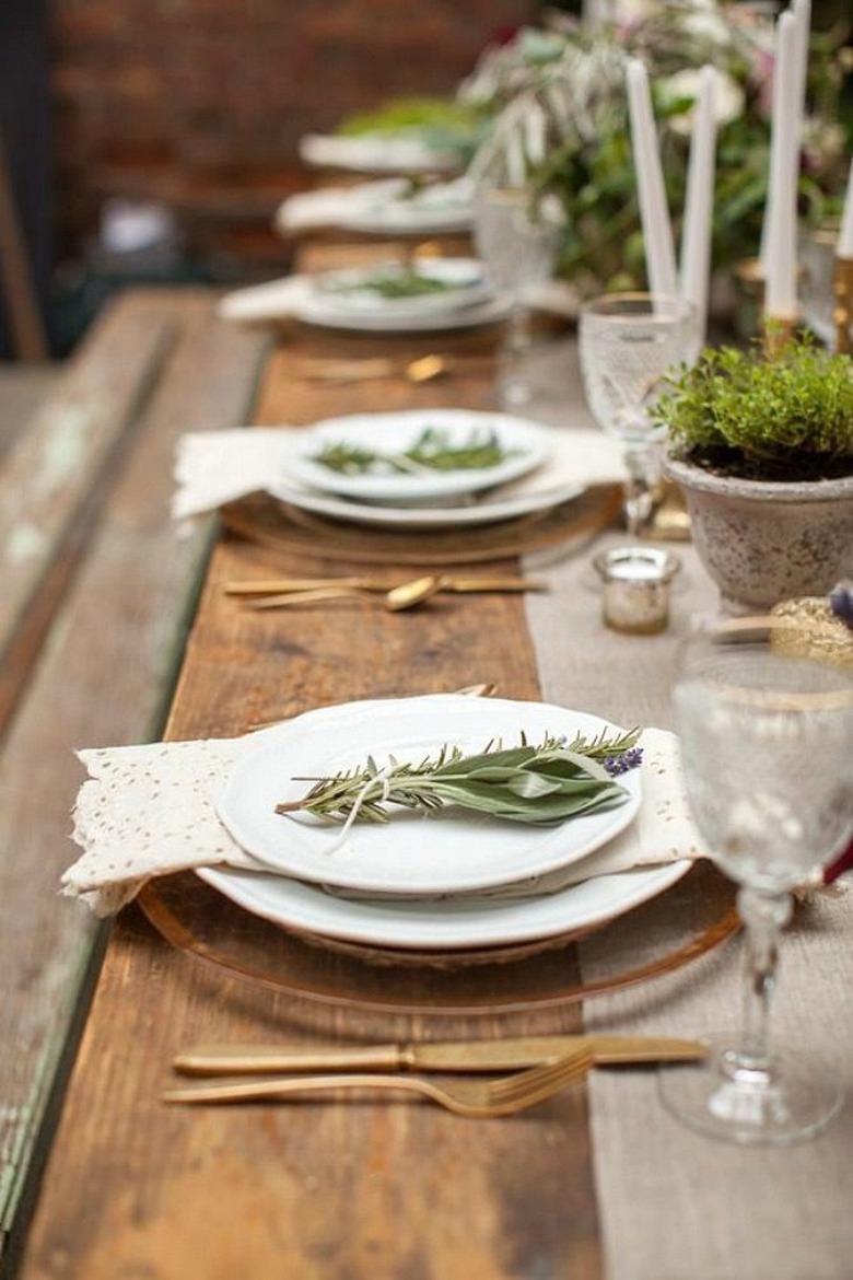 Elegant place settings on rustic dining table