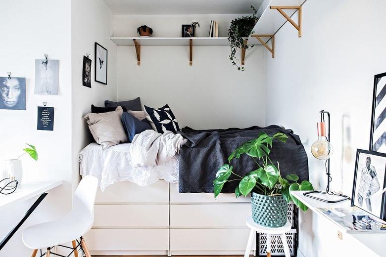 small bedroom with IKEA dressers below bed