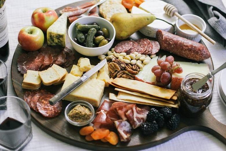 charcuterie spread with cheeses and meats on a tabletop