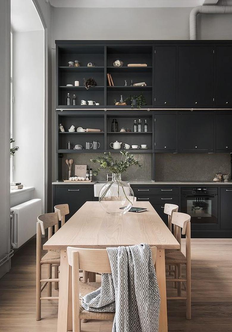 black kitchen with metallic hardware