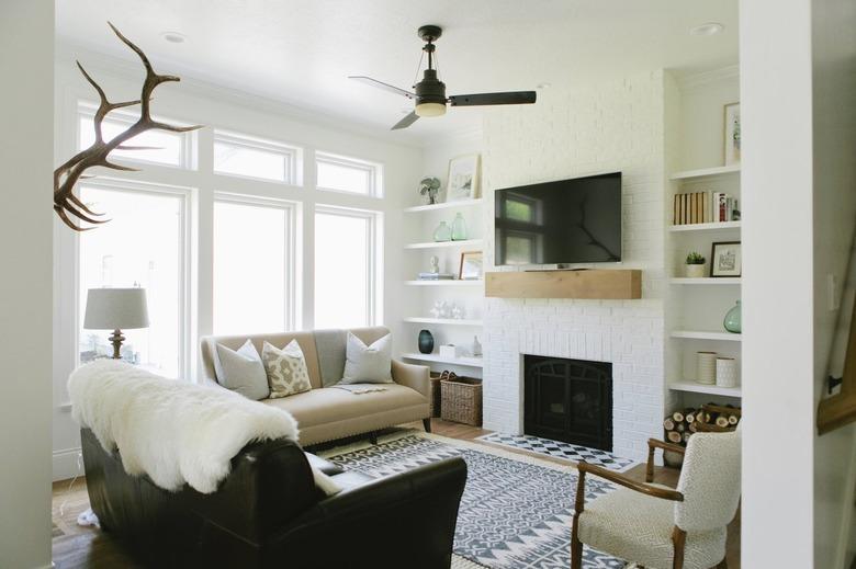 White painted living room with couches and TV