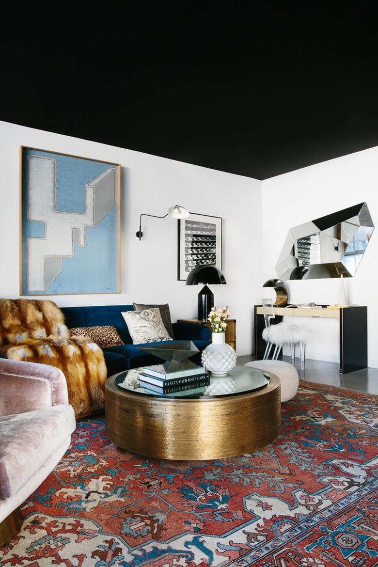 black living room with painted ceiling