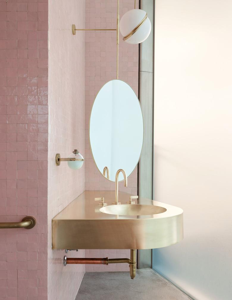 gold bathroom sink idea in pink bathroom