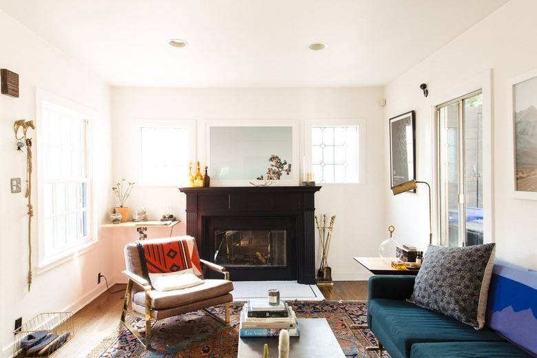 Black fireplace in a sunny white Craftsman style living room