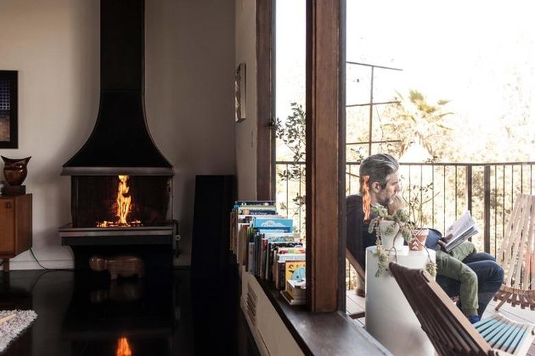 Black freestanding fireplace in modern living room