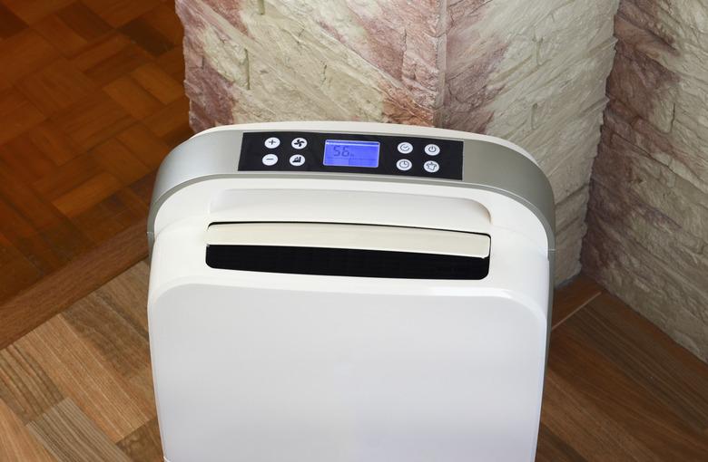 White dehumidifier on wood floor