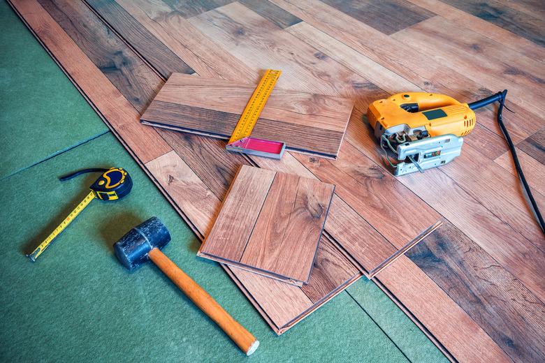 Carpentry tools on laminated floor.