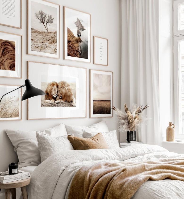 bedroom accent wall filled with artwork