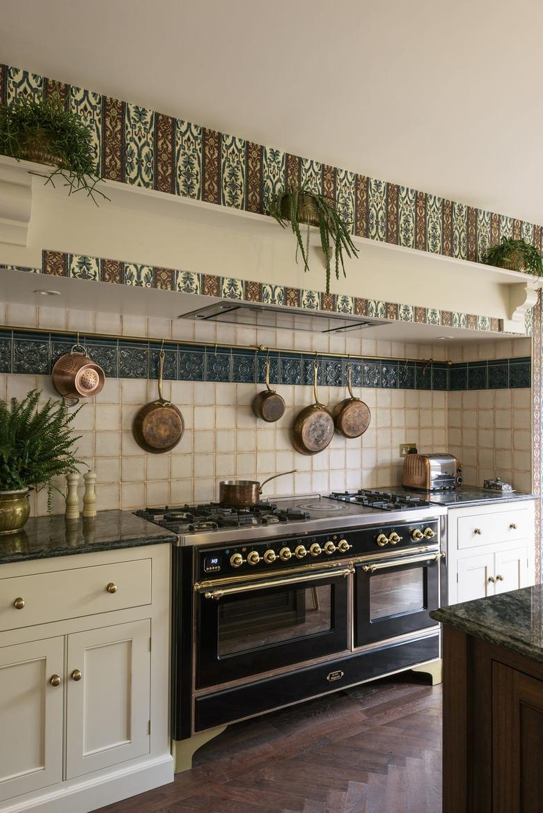 ornate arts and crafts kitchen with patterned tile