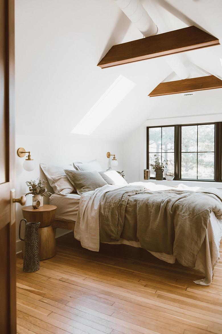 Attic Bedroom Furniture with wood beams and window