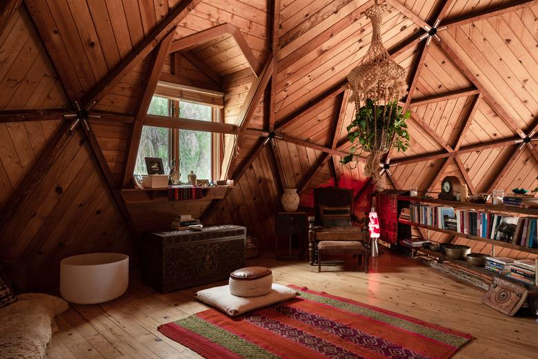 attic living room with knotty pine ceiling