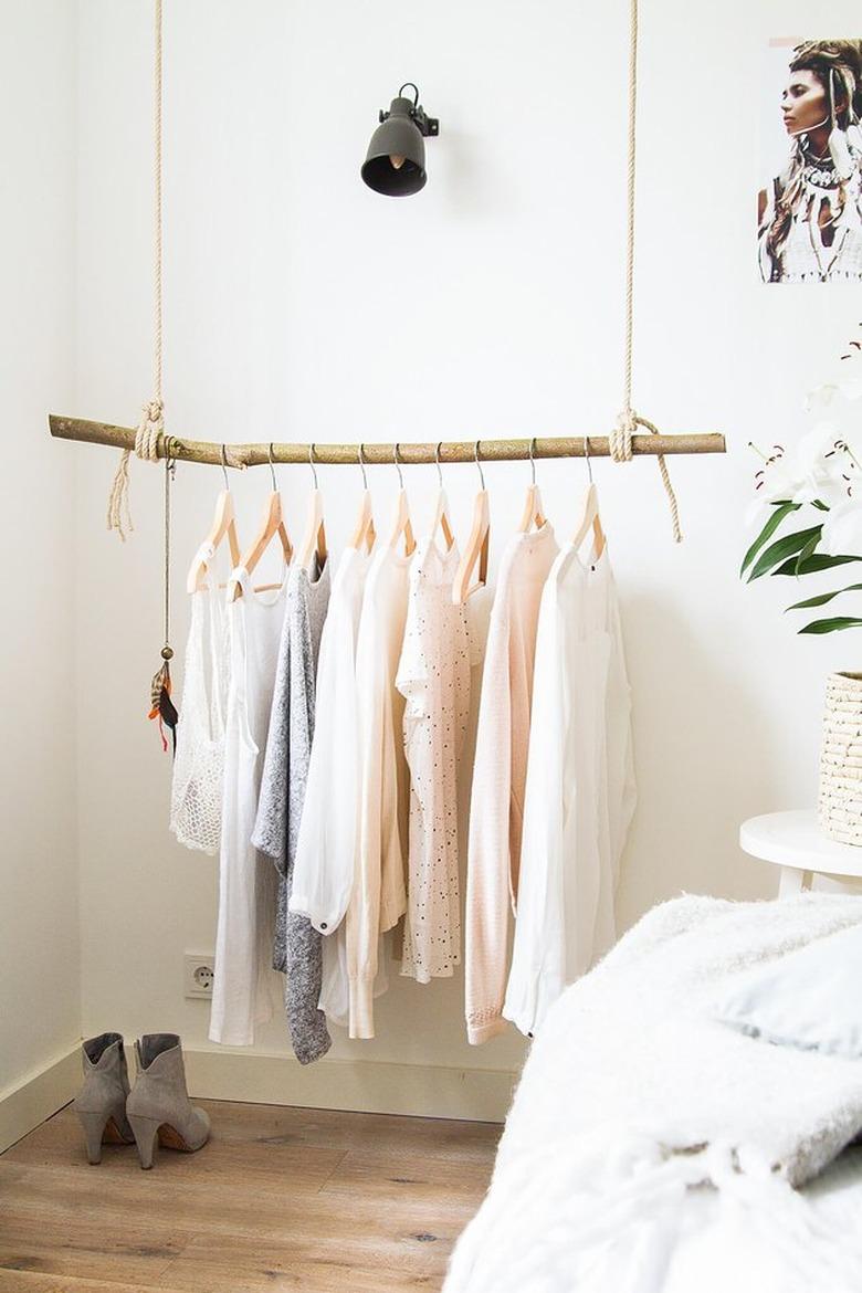 attic storage with hanging clothes rail