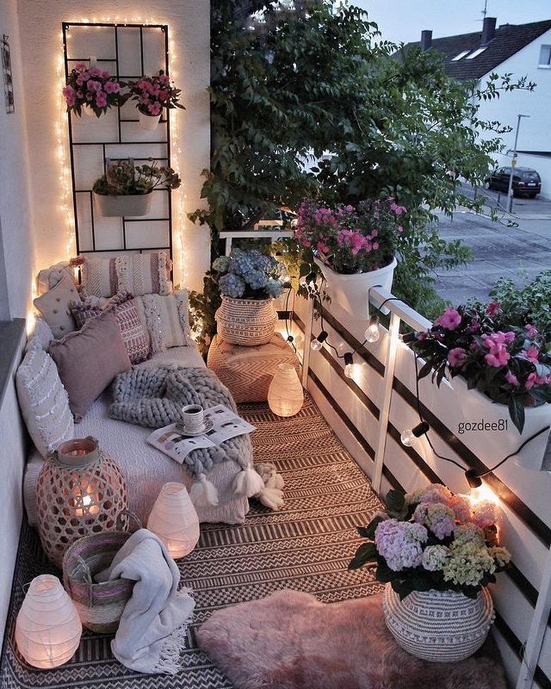 netral balcony with flowers and string lights