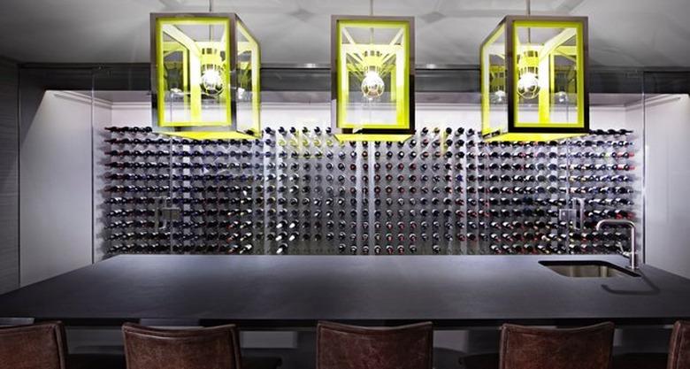 basement ideas in Gray and black basement bar with lime green matching pendant lights.