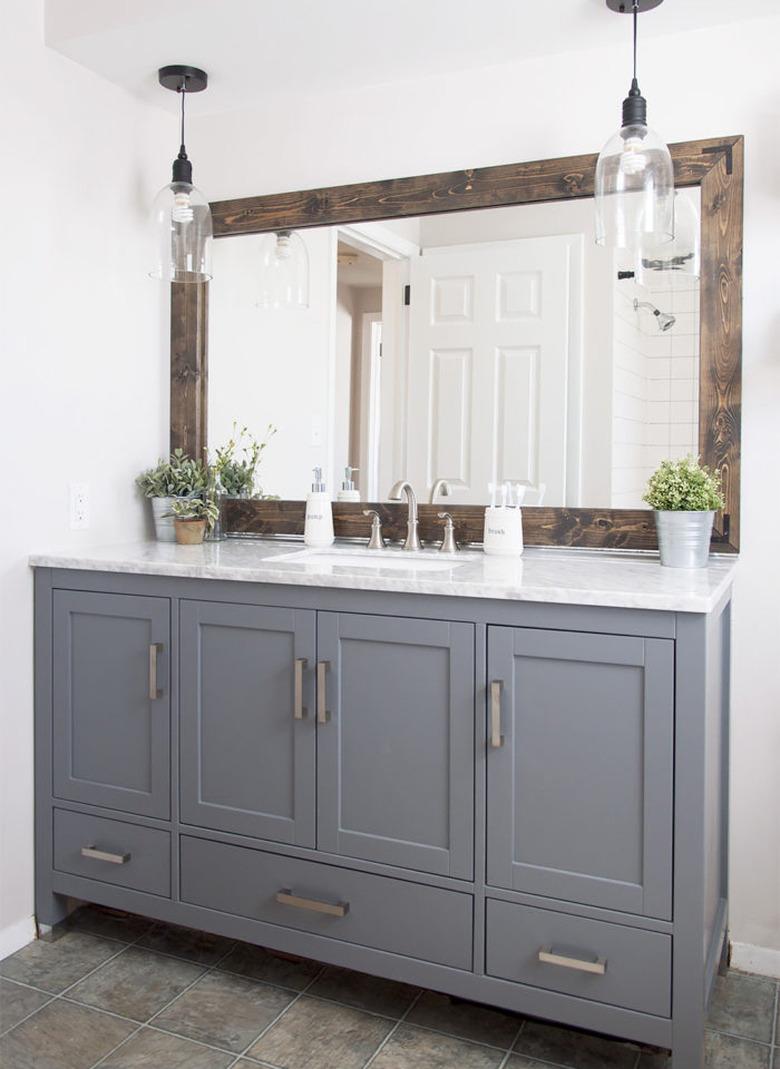 industrial farmhouse bathroom with gray vanity cabinet