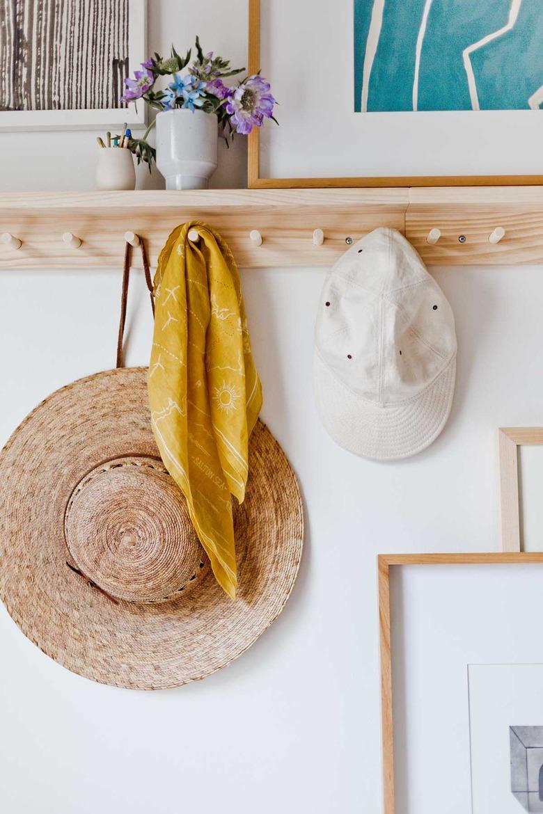 bedroom storage idea with shelf and peg rail