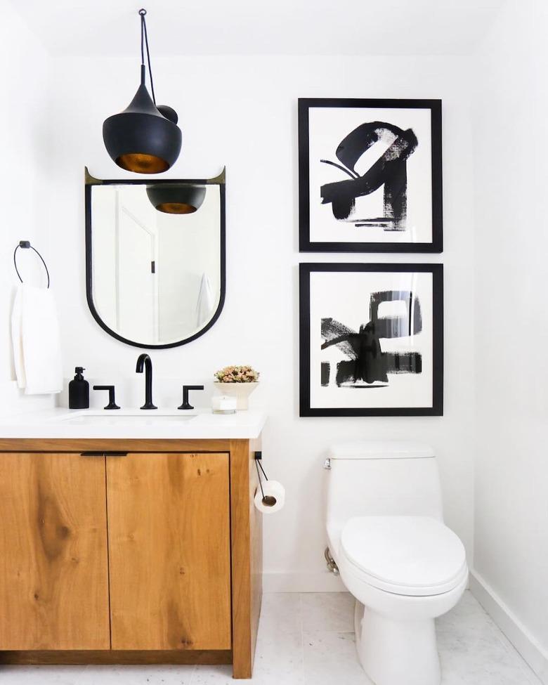 warm wood bathroom vanity idea in black and white bathroom