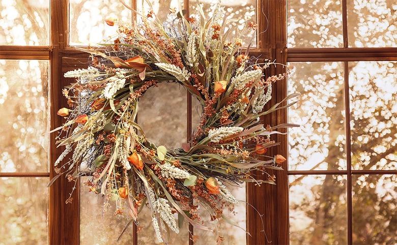 fall wreath hanging on window