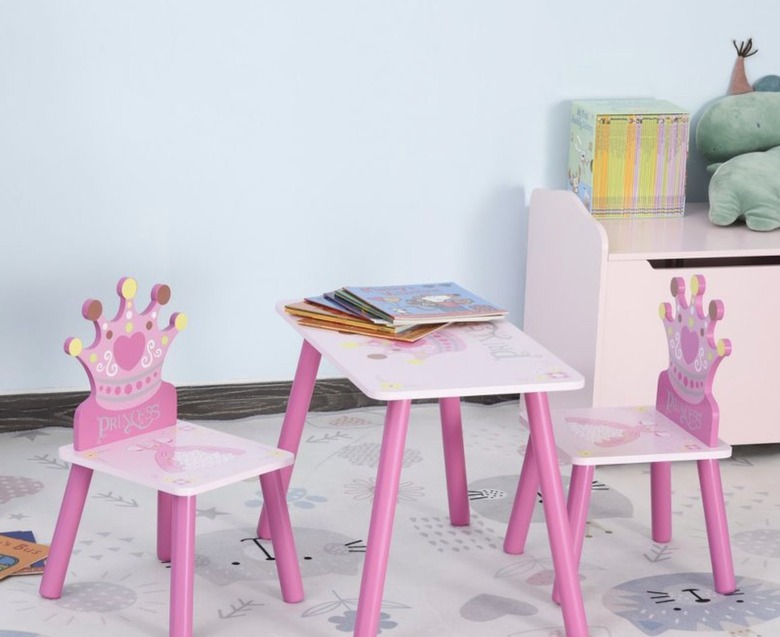 Kids' pink table and chair set with crowns