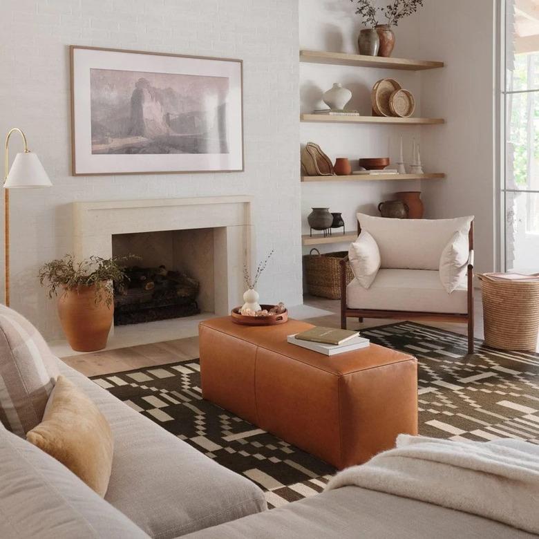 long leather pouf as table in living room