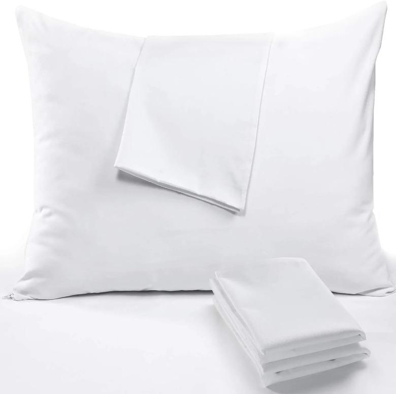 white pillow with folded pillow protectors