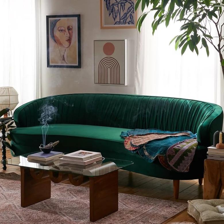 green curved sofa