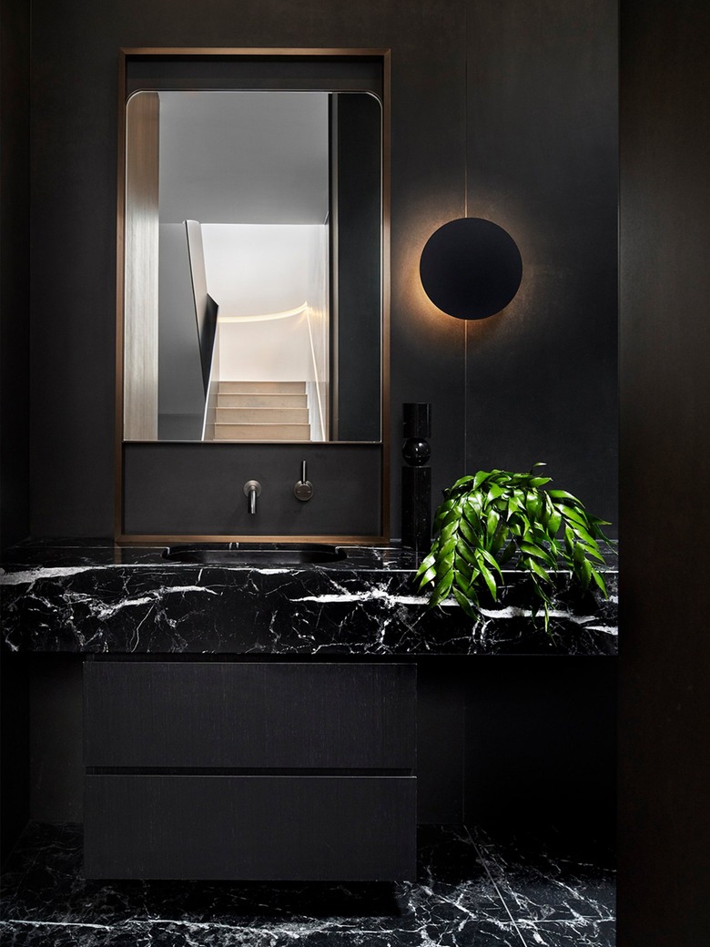 all black bathroom with marble sink