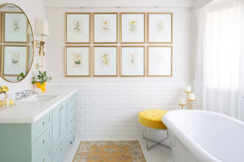 light blue bathroom cabinets in white bathroom