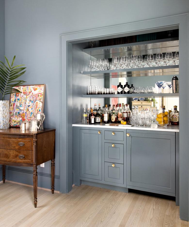 grayish blue paint color in dry bar with shelves and glasses