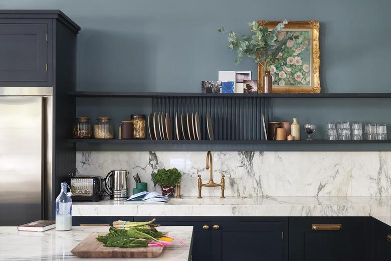 Blue paint color in the kitchen with marble counters