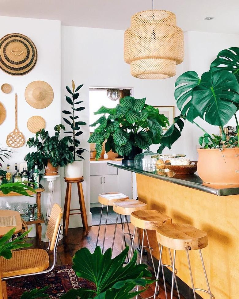 white bohemian kitchen with wooden details and plants