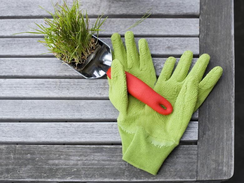 Garden gloves and spade with planter