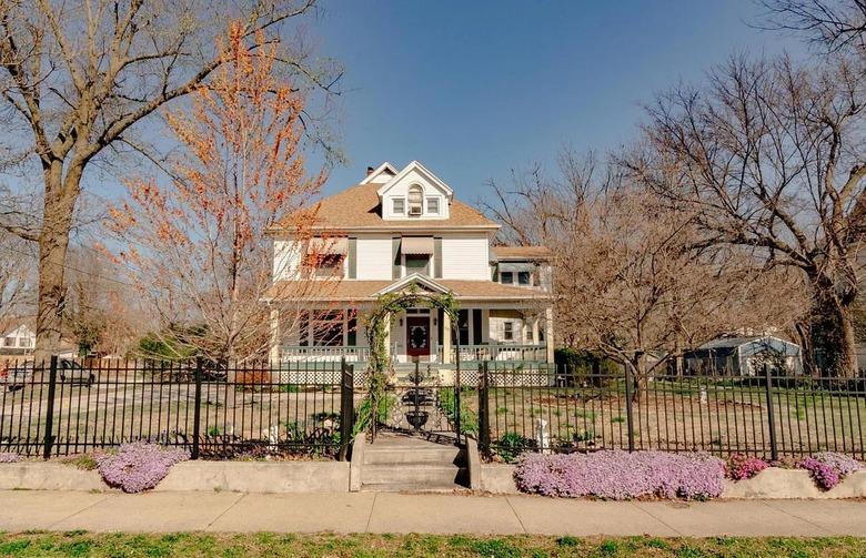 House with a gate and trees in Springfield, Missouri.