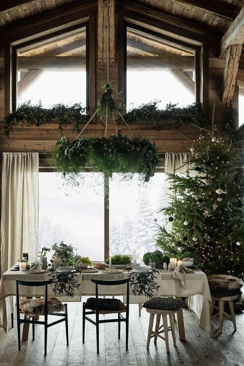 rustic dining room with Christmas window decorations