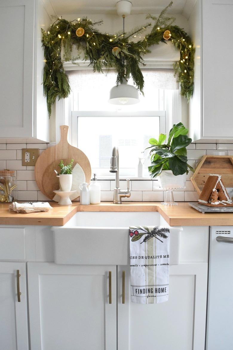 white kitchen with Christmas window decorations