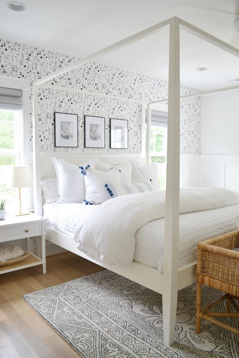 seashell-print wallpaper in coastal bedroom with canopy bed