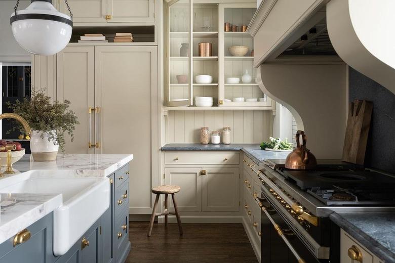 kitchen with greige cabinets, slate blue countertops and island, and dark hardwood floor