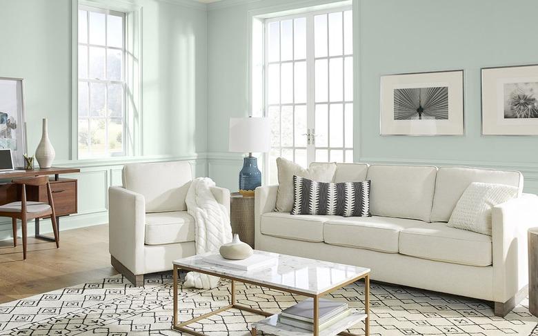 A living room with light blue walls