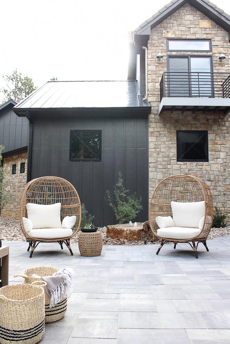 Contemporary home exterior with mix of black siding and stonework