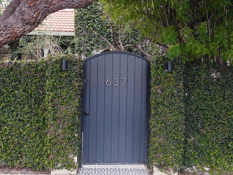 black painted arched exterior door