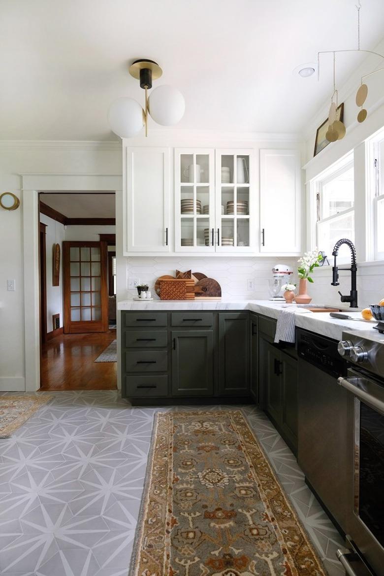 dark kitchen cabinets with light floors with gray and white patterned flooring