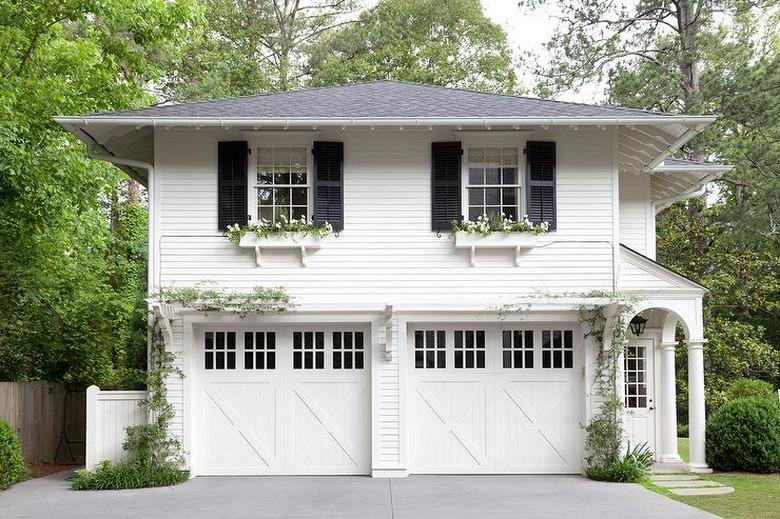 Detached Garage Ideas with traditional two-storey detached garage with shutters