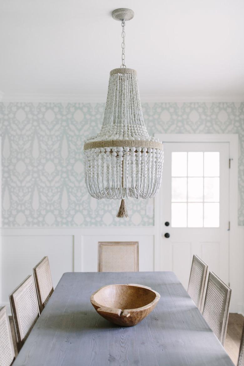 country farmhouse dining room wall idea with blue patterned wallpaper