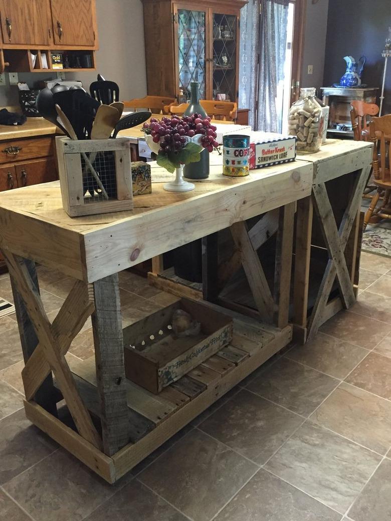 Rectangular island and bar made of wood pallets on tile floor