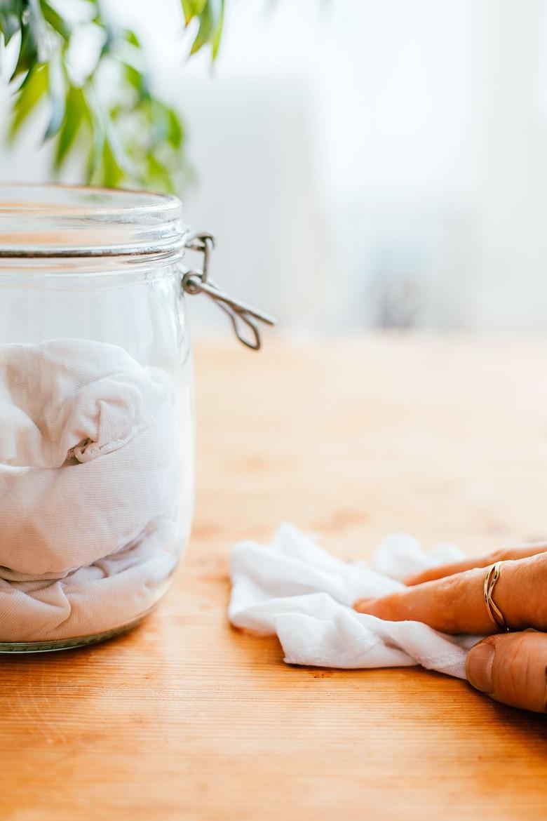 Use reusable cloths for dusting and polishing wood furniture